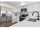 Bright kitchen featuring stainless steel appliances, quartz countertops, and ample storage at 431 W Main St, Lizton, IN 46149