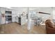 Bright open kitchen with stainless appliances, island eating and connection to living area at 431 W Main St, Lizton, IN 46149