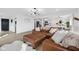 Inviting living room with a plush leather sofa, neutral tones, and an open view to the kitchen and dining area at 431 W Main St, Lizton, IN 46149
