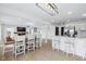 Open-concept living room featuring hardwood floors, a fireplace, and seamless flow into the kitchen at 431 W Main St, Lizton, IN 46149