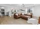 Open-concept living room with a kitchen and hardwood floors, creating a spacious and bright atmosphere at 431 W Main St, Lizton, IN 46149