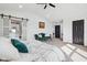 Spacious main bedroom featuring a seating area, barn-door closet, and an en-suite bathroom at 431 W Main St, Lizton, IN 46149