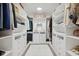 Well-organized walk-in closet featuring custom shelving, drawers, and ample storage space for clothing and accessories at 431 W Main St, Lizton, IN 46149