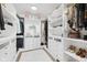 Spacious walk-in closet with custom shelving, drawers, and a plush white rug at 431 W Main St, Lizton, IN 46149
