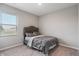 Cozy bedroom with a plush bed, soft carpet, and ample natural light from the window at 432 Bluestem Ln, Whiteland, IN 46184