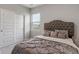 Comfortable bedroom features a plush bed, carpeted floors, and a bright window at 432 Bluestem Ln, Whiteland, IN 46184
