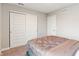 Bedroom featuring carpet floors and a gray bed with a decorative headboard at 432 Bluestem Ln, Whiteland, IN 46184