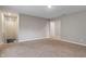 Spacious bonus room with carpet flooring providing ample space for various activities at 432 Bluestem Ln, Whiteland, IN 46184