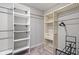 Walk-in closet featuring shelving with a metal rod for hanging clothing at 432 Bluestem Ln, Whiteland, IN 46184