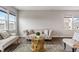 Bright living room with modern wood-style floors and comfortable seating, perfect for relaxing and entertaining at 432 Bluestem Ln, Whiteland, IN 46184