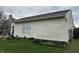 Backyard featuring a garden, grass, and the side of a vinyl-sided home and yard with gardening plots at 4320 Lucky Ct, Indianapolis, IN 46203