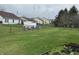 A spacious, fenced backyard with lush green grass and a storage shed provides space for outdoor activities at 4320 Lucky Ct, Indianapolis, IN 46203