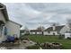 A backyard view includes a patio, play set, lawn, and fence at 4320 Lucky Ct, Indianapolis, IN 46203