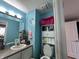 Cozy bathroom featuring a single sink, toilet, and storage cabinet at 4320 Lucky Ct, Indianapolis, IN 46203
