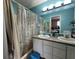 Bright bathroom featuring a double vanity, mirror, tub, and shower at 4320 Lucky Ct, Indianapolis, IN 46203