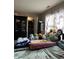 Cozy bedroom with natural light, a wardrobe, and floral bedding at 4320 Lucky Ct, Indianapolis, IN 46203