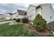 Charming home exterior with manicured landscaping, including bushes and flowerbeds, adding to its curb appeal at 4320 Lucky Ct, Indianapolis, IN 46203