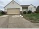Charming single-story home with vinyl siding, attached garage, and well-maintained landscaping at 4320 Lucky Ct, Indianapolis, IN 46203