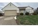 Inviting single-story home featuring vinyl siding, an attached garage, and tidy front yard at 4320 Lucky Ct, Indianapolis, IN 46203