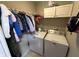 Functional laundry room with washer, dryer, and storage cabinets, providing convenience at 4320 Lucky Ct, Indianapolis, IN 46203