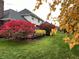 Lush backyard featuring a well-manicured lawn and vibrant shrubbery, creating a serene outdoor space at 5139 Kingswood Dr, Carmel, IN 46033