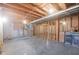 Unfinished basement with exposed ceiling and wooden framing at 5139 Kingswood Dr, Carmel, IN 46033