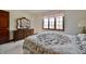 Bedroom with window, carpet, and dresser with mirror at 5139 Kingswood Dr, Carmel, IN 46033