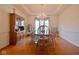 Traditional dining room featuring a wood table, matching hutch, and a chandelier lighting with natural light at 5139 Kingswood Dr, Carmel, IN 46033