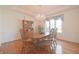 Traditional dining room featuring a wood table, matching hutch, a chandelier and a large window at 5139 Kingswood Dr, Carmel, IN 46033