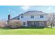 Back view of a two-story home with brick and siding and a large backyard at 5139 Kingswood Dr, Carmel, IN 46033