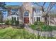 Stunning brick home with a beautiful front entrance and lush landscaping at 5139 Kingswood Dr, Carmel, IN 46033