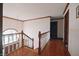 A view of the hallway featuring a hardwood floor, with natural lighting at 5139 Kingswood Dr, Carmel, IN 46033