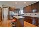 Bright kitchen featuring granite countertops, wood cabinets, stainless steel appliances and hardwood floors at 5139 Kingswood Dr, Carmel, IN 46033