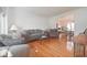 Cozy living room featuring hardwood floors and a view to the adjacent dining room at 5139 Kingswood Dr, Carmel, IN 46033