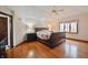 Comfortable main bedroom with hardwood floors, ceiling fan, and a large window at 5139 Kingswood Dr, Carmel, IN 46033