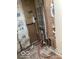 Image of a bathroom during renovation with exposed pipes, unfinished walls, and wooden flooring at 5657 E Fall Creek Pkwy N Dr, Indianapolis, IN 46226