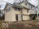 View of the side of the home with an exposed foundation and wood siding at 5657 E Fall Creek Pkwy N Dr, Indianapolis, IN 46226