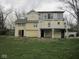 A two-story home with a deck on the back and a lawn at 5657 E Fall Creek Pkwy N Dr, Indianapolis, IN 46226