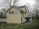 A two-story house with a deck and green lawn at 5657 E Fall Creek Pkwy N Dr, Indianapolis, IN 46226