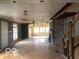 Bright living room with exposed walls and hardwood floors, showing lots of natural light at 5657 E Fall Creek Pkwy N Dr, Indianapolis, IN 46226