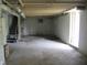 An unfinished basement with concrete floors and open ceiling at 5657 E Fall Creek Pkwy N Dr, Indianapolis, IN 46226