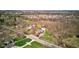 Aerial view of the property with mature trees and an in-ground pool in a neighborhood setting at 6170 Shelbyville Rd, Indianapolis, IN 46237