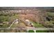 Expansive property with mature trees, a pool, and outbuilding surrounded by nature and neighborhood at 6170 Shelbyville Rd, Indianapolis, IN 46237