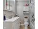 A clean bathroom includes a white vanity and a matching toilet at 6170 Shelbyville Rd, Indianapolis, IN 46237