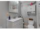 A clean bathroom includes a white vanity and a matching toilet at 6170 Shelbyville Rd, Indianapolis, IN 46237