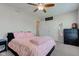 This bedroom features neutral walls and a light-colored ceiling fan at 6170 Shelbyville Rd, Indianapolis, IN 46237