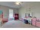 A bedroom with beige carpet and furnishings at 6170 Shelbyville Rd, Indianapolis, IN 46237