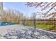 A spacious gray wood deck with black metal railing at 6170 Shelbyville Rd, Indianapolis, IN 46237