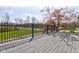 The back deck overlooks a green lawn and trees at 6170 Shelbyville Rd, Indianapolis, IN 46237