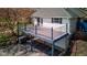 Open deck with black iron railing, offering a place for outdoor relaxation and entertainment with easy access to the home at 6170 Shelbyville Rd, Indianapolis, IN 46237